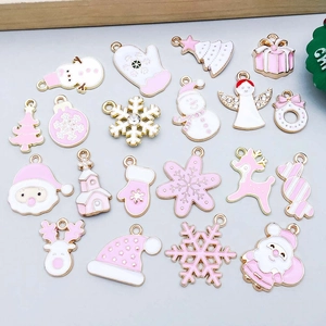 Pink and gold Christmas charms set with snowflake and Santa patterns for DIY jewelry making