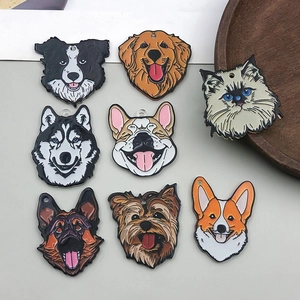 Detailed view of colorful enamel dog and cat breed charms for jewelry and keychains