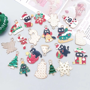Detailed assortment of colorful enamel Christmas charms including snowmen and candy canes