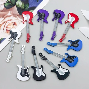 Detailed close-up of colorful enamel guitar charms for DIY jewelry making accessories