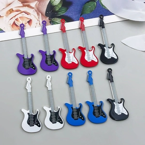 Close-up of colorful alloy guitar pendants for DIY jewelry making in five assorted colors