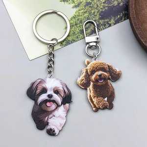 Detailed close-up of colorful acrylic dog pendants with durable silver metal keychains