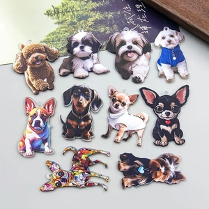 Detailed view of assorted acrylic dog charms with double-sided printing and hanging holes