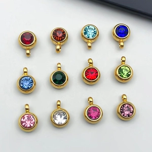 Set of twelve colorful round faceted gemstone pendants with gold stainless steel bases