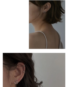 Gros plan d'un ensemble de créoles en argent et d'un ear cuff portés par un mannequin