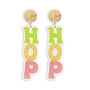 Macro shot of Easter dangle earrings with shiny gold metal studs and HOP glitter letters
