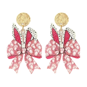 Detail of Easter bow earrings with pink glitter bunny ears and black polka dots