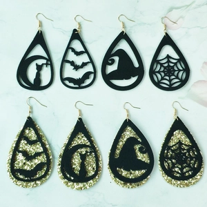 Detail view of Halloween earrings featuring black cat, bat, witch hat and spider web designs