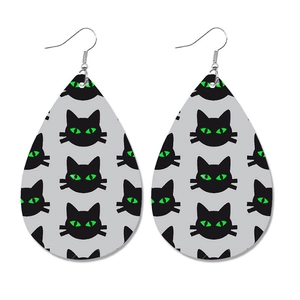 Faux leather teardrop earrings featuring a black cat print with bright neon green eyes