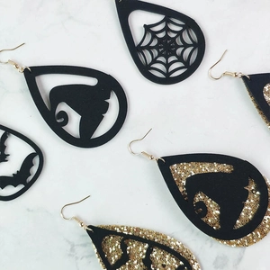 Halloween drop earrings featuring black wizard hat and golden glitter spider web designs