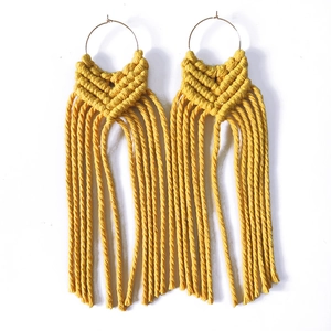 Handmade mustard yellow macrame tassel hoop earrings in bohemian geometric style