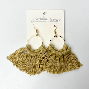 Handmade Bohemian tassel earrings in khaki cotton with gold metal rings on display card