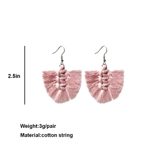 Detailed view of pink woven tassel earrings showing 2.5 inch length and 3g weight specs
