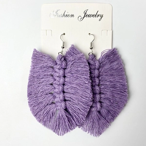 Handmade purple woven tassel earrings in bohemian feather style on fashion card