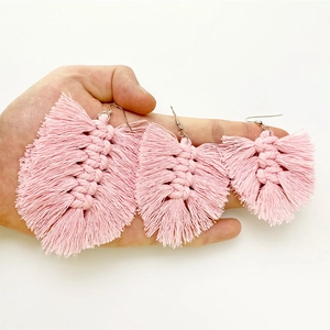 Pink handmade macrame fringe earrings in three sizes shown for scale and detail