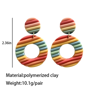 Rainbow striped polymer clay hoop earrings with a textured geometric circular design