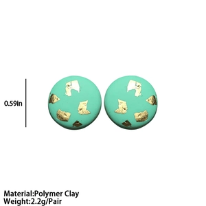 Handmade mint green polymer clay stud earrings with gold foil accents and round design