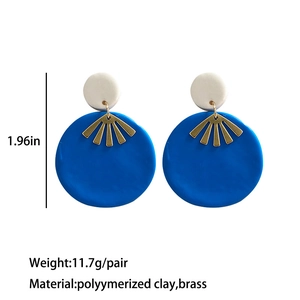 Royal blue geometric polymer clay earrings with brass accents in a modern circular design