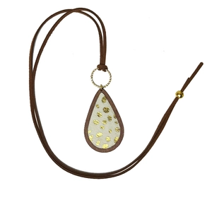 Bohemian wood leopard print drop necklace with turquoise accents and gold dots on white background
