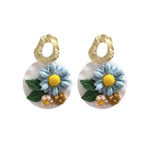 Handmade polymer clay daisy flower earrings with vintage gold textured metal hoops