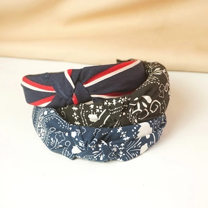 Three-piece set of twisted wide headbands featuring vintage floral and stripe patterns