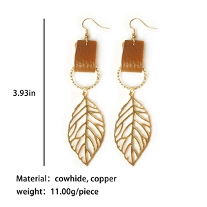 Detailed view of leather and copper leaf earrings with size specs and materials
