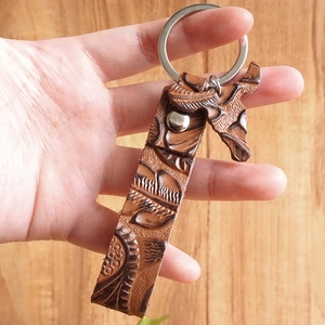 Retro brown embossed leather keychain with silver metal ring and leaf pendant