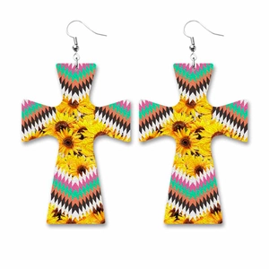 Detail view of cross-shaped faux leather earrings featuring sunflowers and geometric patterns