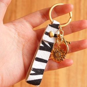 Zebra pattern hair-on leather keychain with golden sunflower metal pendant and ring