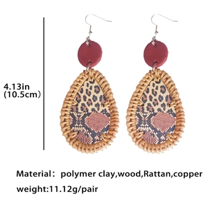 Bohemian teardrop earrings with rattan frame, leopard print leather, and red clay disk