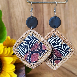 Exotic earring detail with zebra print textures and natural rattan woven borders