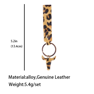 Detailed view of genuine leather leopard print keychain with bull head pendant and sizing