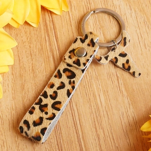 Detail shot of leopard print hair-on-leather keychain with silver metal bull head charm