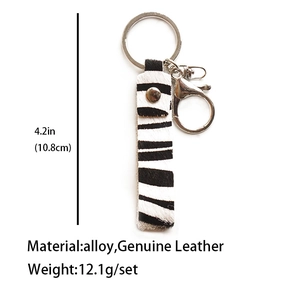 Detail of zebra pattern hair-on leather keychain with silver alloy hardware and dimensions