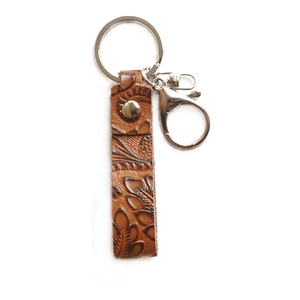 Vintage brown embossed leather keychain with floral pattern and silver lobster clasp