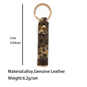Detail view of leopard print leather keychain with size dimensions and material info