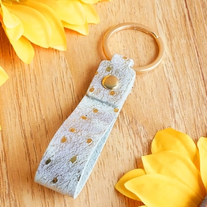Chic key ring with gold-dotted grey leather and premium metallic gold circular hardware