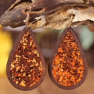 Handmade teardrop earrings with orange glitter wood frame and gold hooks for Halloween