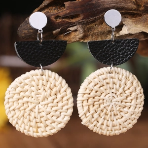Handmade rattan geometric earrings with black leather and silver metal studs in boho style