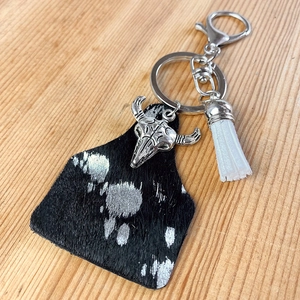 Western style horsehair cow ear tag keychain with silver skull and white tassel