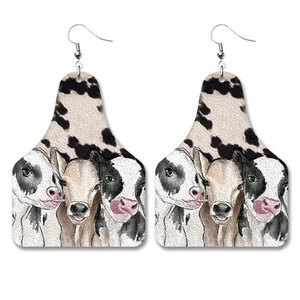 Faux leather livestock tag earrings featuring black and white cow print with cattle graphics