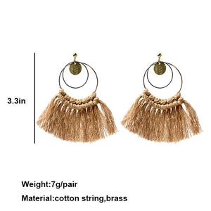Detail of woven cotton tassel earrings with brass rings showing 3.3 inch size dimensions