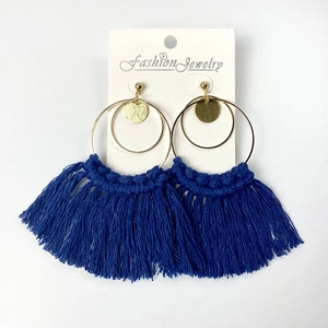 Bohemian deep blue tassel earrings with golden metal rings on a white fashion card