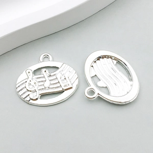 Detailed macro of a silver alloy musical note pendant for DIY jewelry making