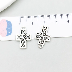Detail view of vintage silver hollow cross pendant showing precise 25mm length measurement
