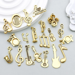 Breloques instruments de musique dorées et notes pour la création de bijoux DIY