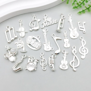 Detailed collection of silver musical instrument charms including guitars and notes for DIY jewelry
