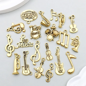 Lot détaillé de breloques instruments de musique dorés pour création bijoux DIY