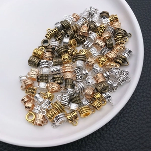 Close-up of vintage alloy spacer beads with intricate floral patterns for DIY jewelry