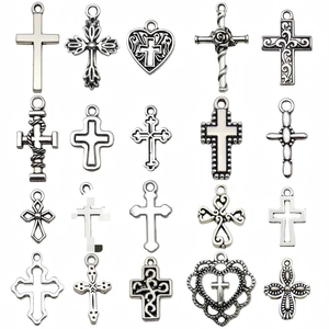 Collection of 20 vintage silver alloy hollow cross pendants with floral heart motifs
